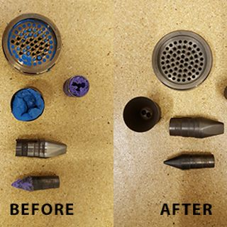 Various tooling and metal components that are thermally cleaned in a fluidized bath with aluminum oxide media.